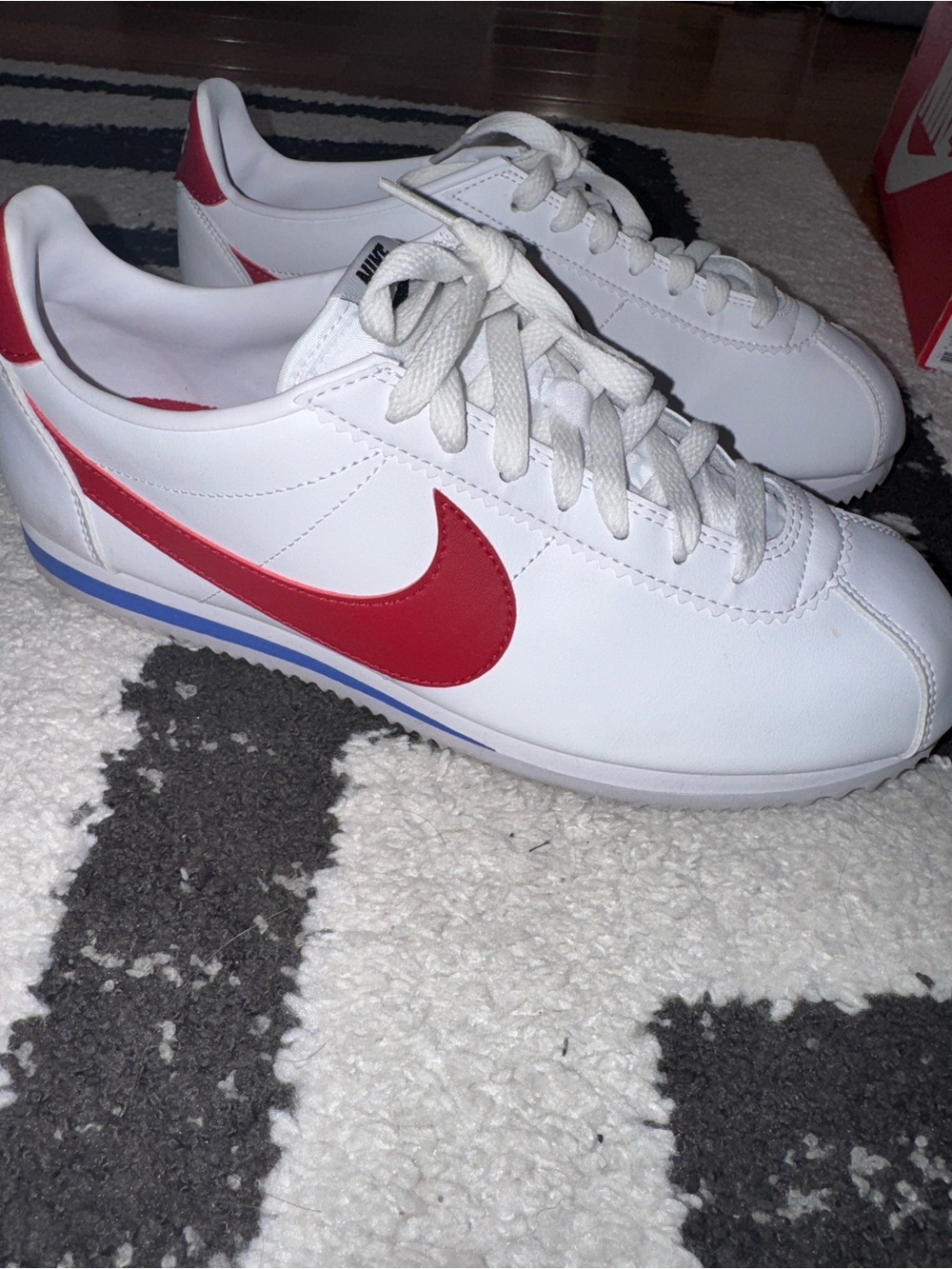 Nike White Leather Sneakers with Red Swoosh and Blue Trim